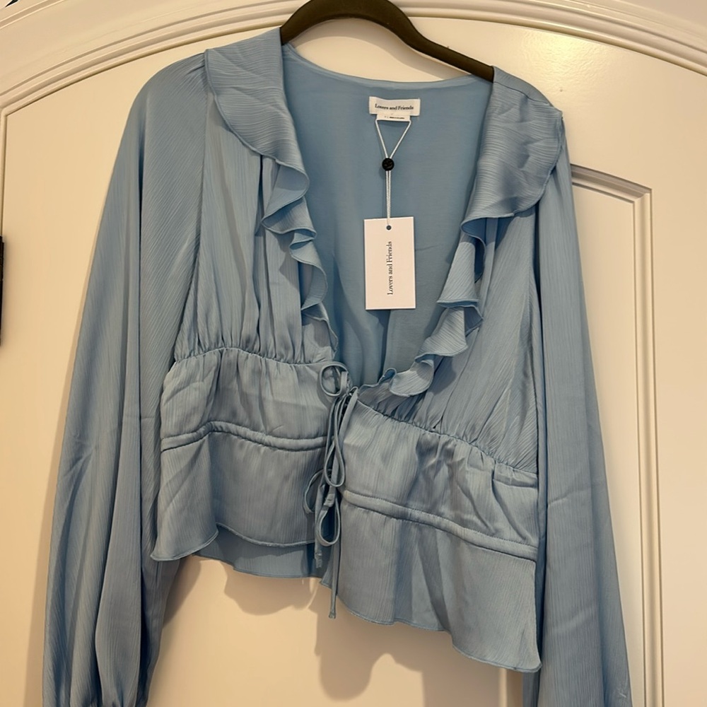NWT. Size small. Lovers and friends, blue blouse